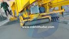 Sloping concrete paving machine